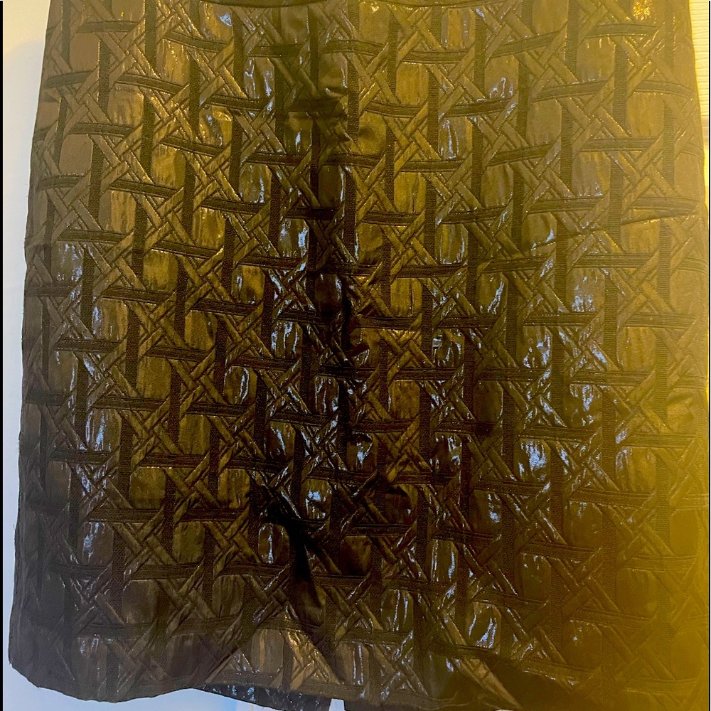 Black skirt with details small slit in back and zipper no elastic size 10
